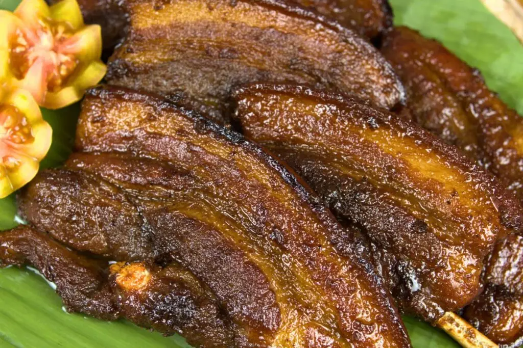 No-grill pork belly barbecue cooked Filipino style on a banana leaf