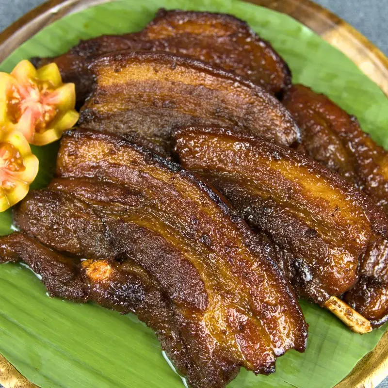 Caramelized pork belly barbecue on banana leaves, stovetop style