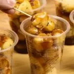 street-style veggie balls serve in plastic cups with savory Manong sauce