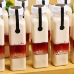 Strawberry Jelly Milk Drink in a square PET bottle with layers of jelly, tapioca pearls, strawberry jam, and creamy milk