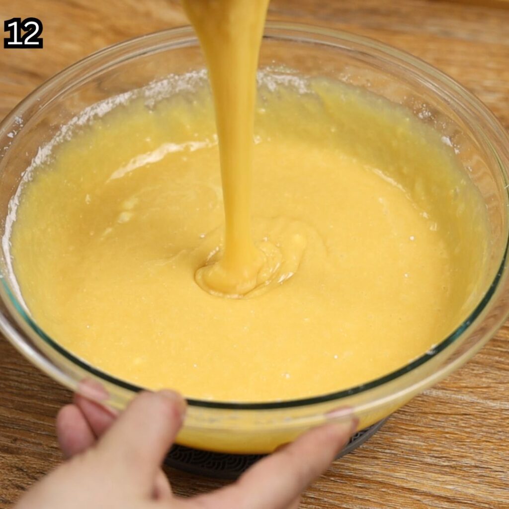 Mixing the batter until smooth and no lumps remain for Condensed Milk Cake Bars.