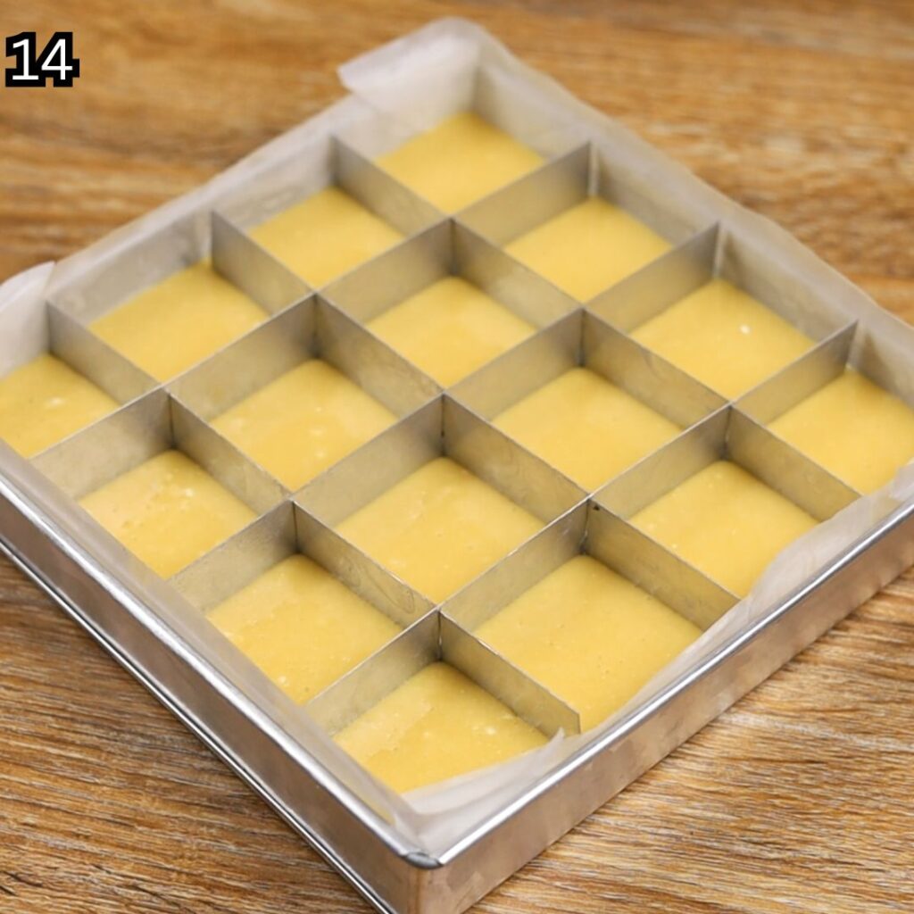 Inserting the divider into the cake batter before baking Condensed Milk Cake Bars.