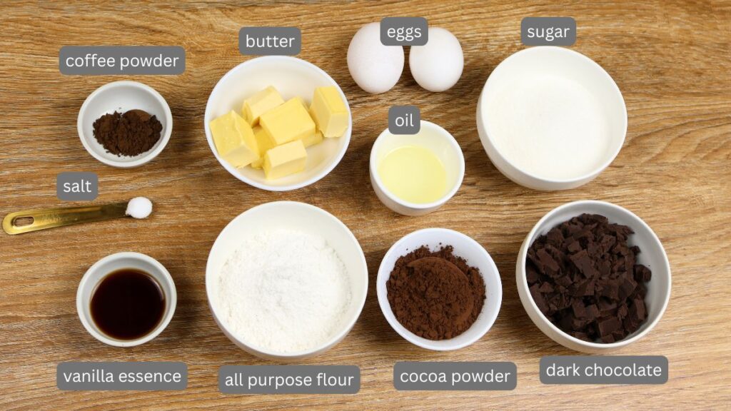 Ingredients for fudgy brownies including dark chocolate, butter, oil, cocoa powder, instant coffee, eggs, sugar, vanilla extract, all-purpose flour, and salt.