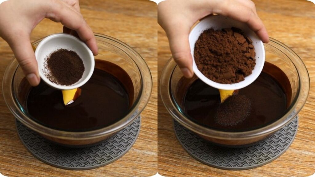 Coffee powder and cocoa powder being added to a bowl of melted chocolate, butter, and oil for brownie batter