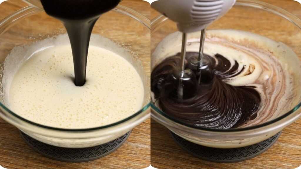 Pouring melted chocolate mixture into whisked eggs and mixing until combined for fudgy brownie batter