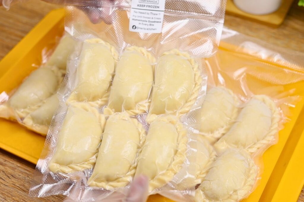 Frozen crispy corned beef empanadas sealed in a vacuum pouch for easy storage